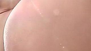 Brunette Babe Nude Outdoor Tease on Inflatable