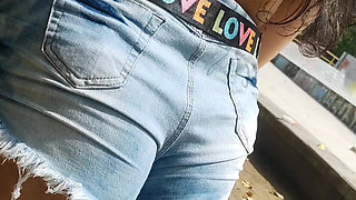 Hot girl showing off in shorts on the street