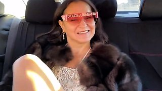 Fur-coated stepmom gives stepson a blowjob in the car