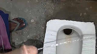 Desi Bhabhi Holding Stepbrother-in-law's Penis and Making Him Pee and Peeing Herself