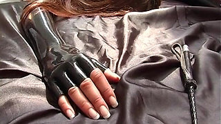 Bound Beauty in Latex BDSM Submission