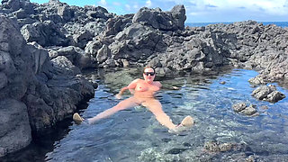 Nudist Girl Swimming Naked in the Natural Pool Outdoor