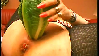 Nasty granny puts anything she can find in her pussy