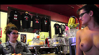 Two dykes in the kitchen playing with ice cream