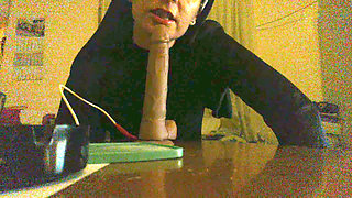 Mature slut  sucking big dildo