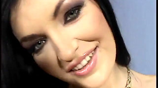 Whore with long black hair sucks hard cock on couch