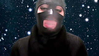 Smoking and teasing you in a latex mask