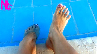 Barefoot Dangling in Swimming Pool Water
