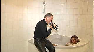 Sexy teen loves taking a bath and posing for the camera