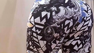 Twerking in gym shorts and juggling his butt on the chair
