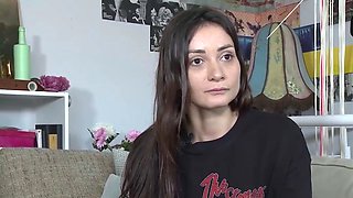 Amateur black-haired masturbates with a toy